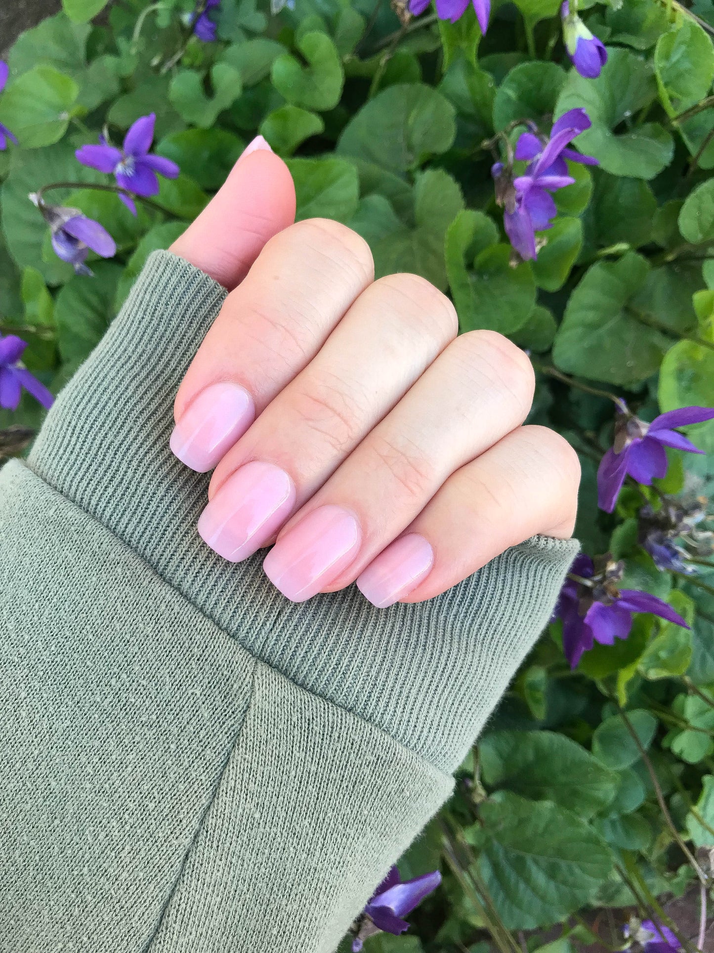 A set of press on nails, baby pink, short, and rounded square.