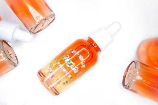 An orange bottle of a clear liquid used to break down the glue used to apply press on nails. A natural compound, 100% vegan, anti-fungal, orange scented remover. 
